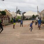 Kids playing football in the streets